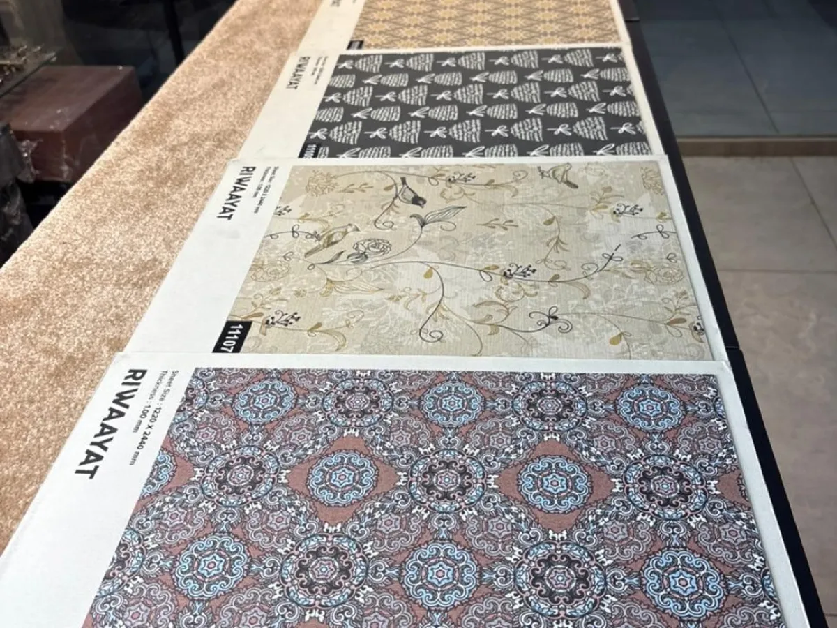 A long counter display of patterned decorative laminate sheets